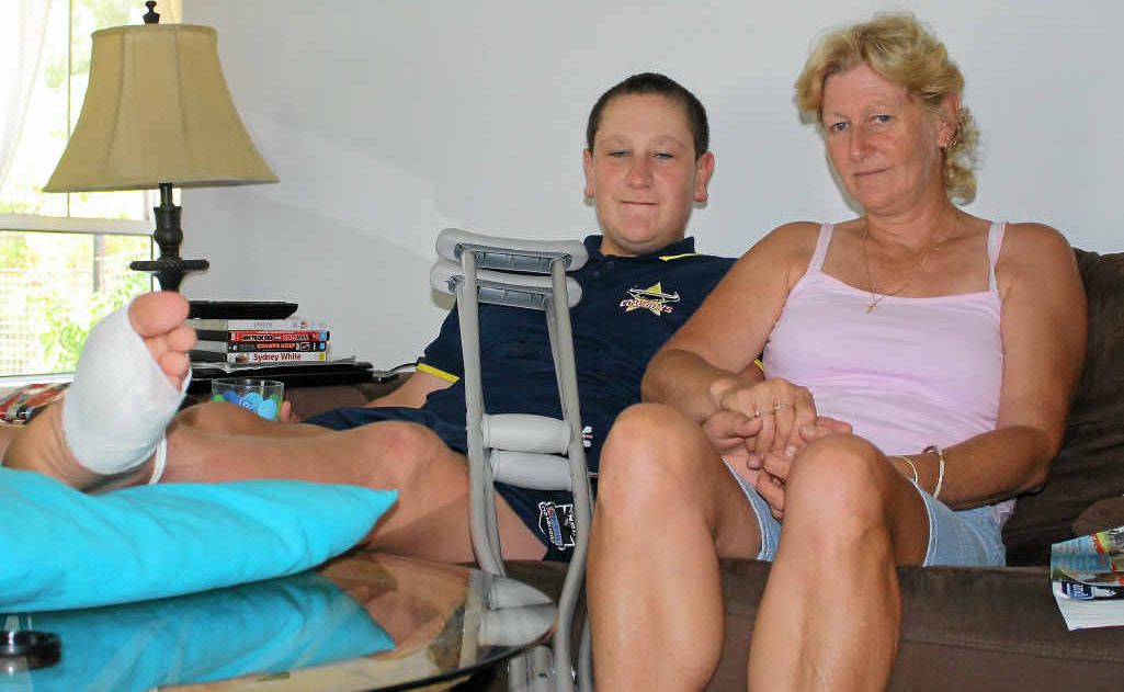 Reilly is recovering from surgery with the help of his mother Jenene Moore, who said Warwick Hospital staff refused to remove a sewing needle from his foot. Reilly is recovering from surgery with the help of his mother Jenene Moore, who said Warwick Hospital staff refused to remove a sewing needle from his foot.